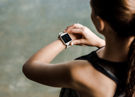 woman-looking-at-waterproof-smartwatch